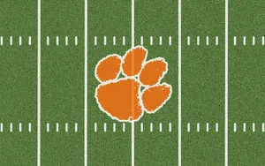 Clemson Tigers Football Logo On Field Wallpaper