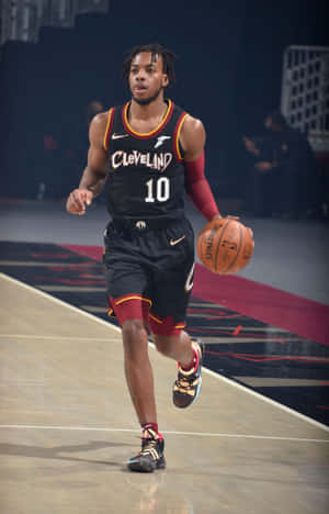 Cleveland Cavaliers Player Dribbling Basketball Wallpaper