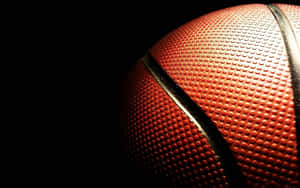 Close Up Basketball Texture Dark Background.jpg Wallpaper