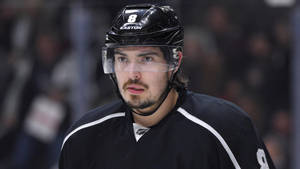 Close Up Look Of Drew Doughty Biting Lip While Focusing On Game Wallpaper