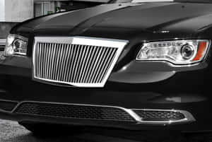 Close-up Of A Glossy Car Grill On A Luxury Automobile Wallpaper