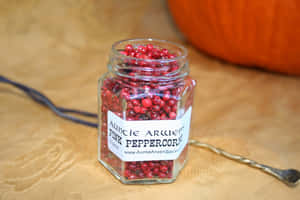 Close-up Of Pink Peppercorns With Branch Wallpaper