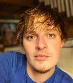 Close Up Portraitof Manin Blue Shirt Wallpaper