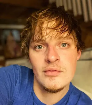 Close Up Portraitof Manin Blue Shirt Wallpaper