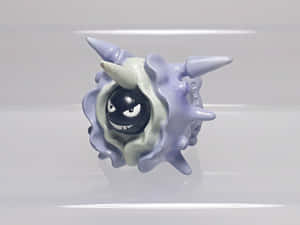 Close-up Shot Of A Plastic Cloyster Toy Wallpaper