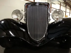 Close-up View Of A Car Grill On A Sleek, Modern Vehicle Wallpaper
