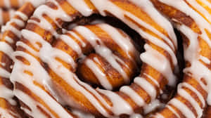 Closeup Cinnamon Rollwith Icing Wallpaper