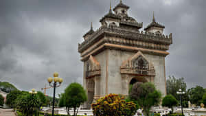 Cloudy Overcast At Patuxai Monument Wallpaper