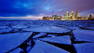 Cn Tower By A Frozen Lake Wallpaper