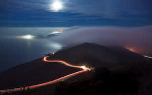 Coastal_ Nighttime_ Light_ Trails Wallpaper