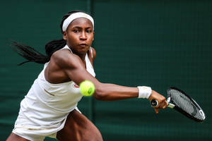 Coco Gauff Hitting A Fast Ball Wallpaper