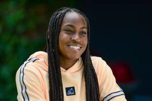 Coco Gauff In Light Orange Jacket Wallpaper