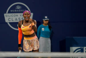 Coco Gauff Orange Tennis Uniform Wallpaper