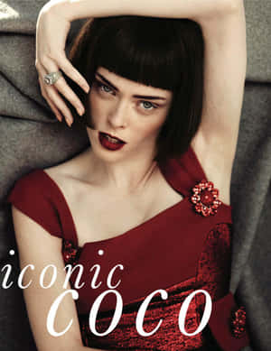 Coco Rocha Strikes A Graceful Pose On A City Street Wallpaper