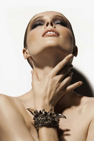 Coco Rocha Twirling In A Striking Red Ensemble Wallpaper