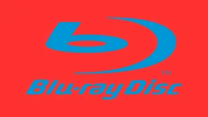 Collection Of 4k Blu-ray Movies On Wall Shelves Wallpaper