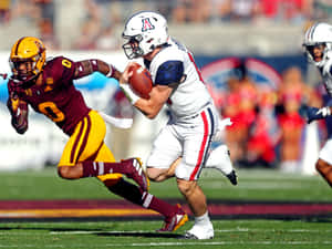 College Football Action Quarterback Run Wallpaper