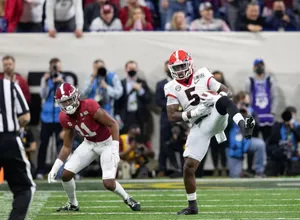 College_ Football_ Action_ Shot Wallpaper