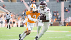 College Football Action Tennesseevs Texas A M Wallpaper