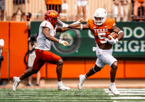 College Football Action Texasvs Opponent Wallpaper