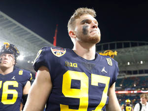 College Football Playoff Michigan Wolverines Aidan Hutchinson Wallpaper