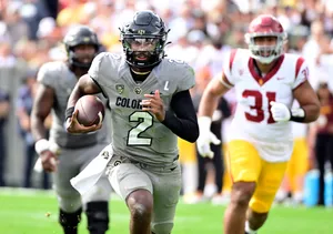 College Football Quarterback Action Wallpaper