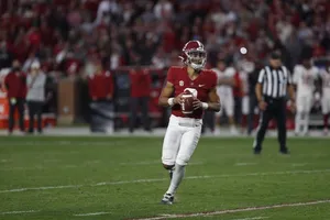 College Quarterback Action Shot Wallpaper