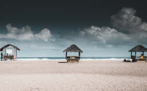 Colorful Beach Huts In A Row Wallpaper