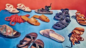 Colorful Beach Sandals On White Sand Wallpaper