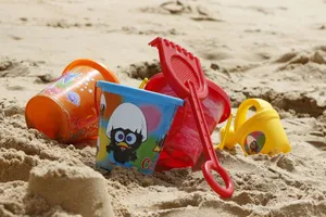 Colorful Beach Toys On The Sand Wallpaper