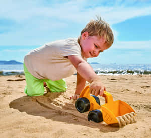 Colorful Beach Toys On The Sand Wallpaper