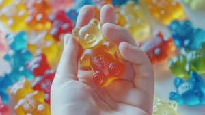 Colorful Gummy Bearin Hand Wallpaper