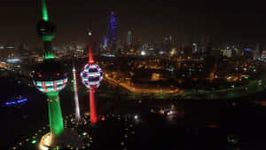 Colorful Lights Kuwait Towers At Night Wallpaper