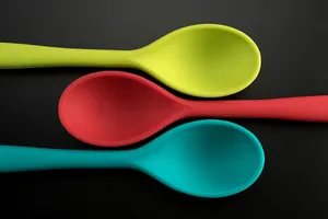 Colorful Plastic Spoons Black Background Wallpaper