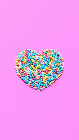 Colorful Sprinkles Hearton Pink Background Wallpaper
