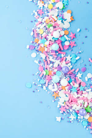 Colorful Sprinkleson Blue Background.jpg Wallpaper