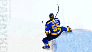 Colton Parayko Powerfully Striking The Puck In A Game Wallpaper