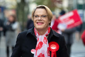 Comedian Eddie Izzard Performing On Stage Wallpaper