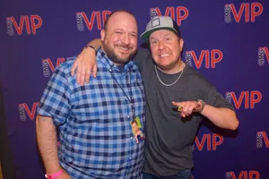 Comedian Nick Swardson Laughing On Stage Wallpaper