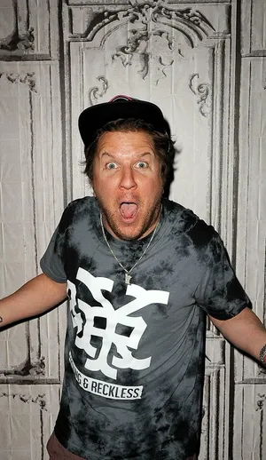 Comedian Nick Swardson Performing On Stage Wallpaper