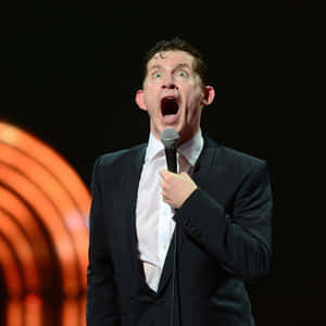 Comedian Performingon Stage Wallpaper