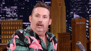 Comedianin Flamingo Shirt During Interview Wallpaper