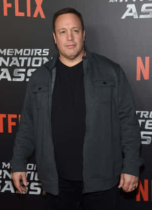 Comedic Genius Kevin James In A Moment Of Pause Wallpaper