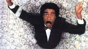 Comedy Legend Richard Pryor In Action Wallpaper