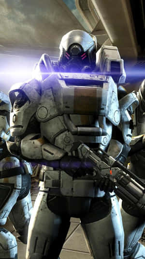 Commander Shepard Battles Against Cerberus Forces In Mass Effect Wallpaper