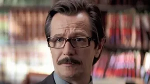 Commissioner Gordon Standing Vigilant In Gotham City Wallpaper