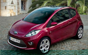 Compact Car On The Road Wallpaper