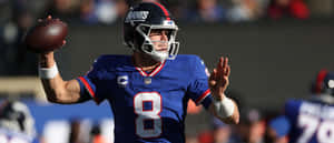 Concentration Before The Play - Nfl Quarterback In Action Wallpaper