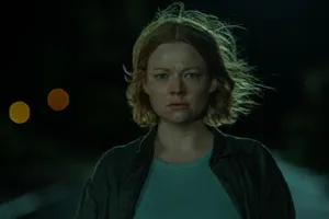 Concerned Woman Nighttime Scene Wallpaper