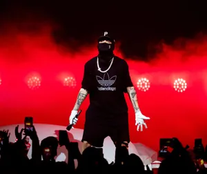 Concert_ Performer_in_ Silhouette_ Red_ Background.jpg Wallpaper